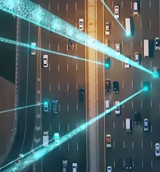 An aerial view of a multi-lane highway with various vehicles, overlaid with bright light streaks, likely representing the flow of traffic data