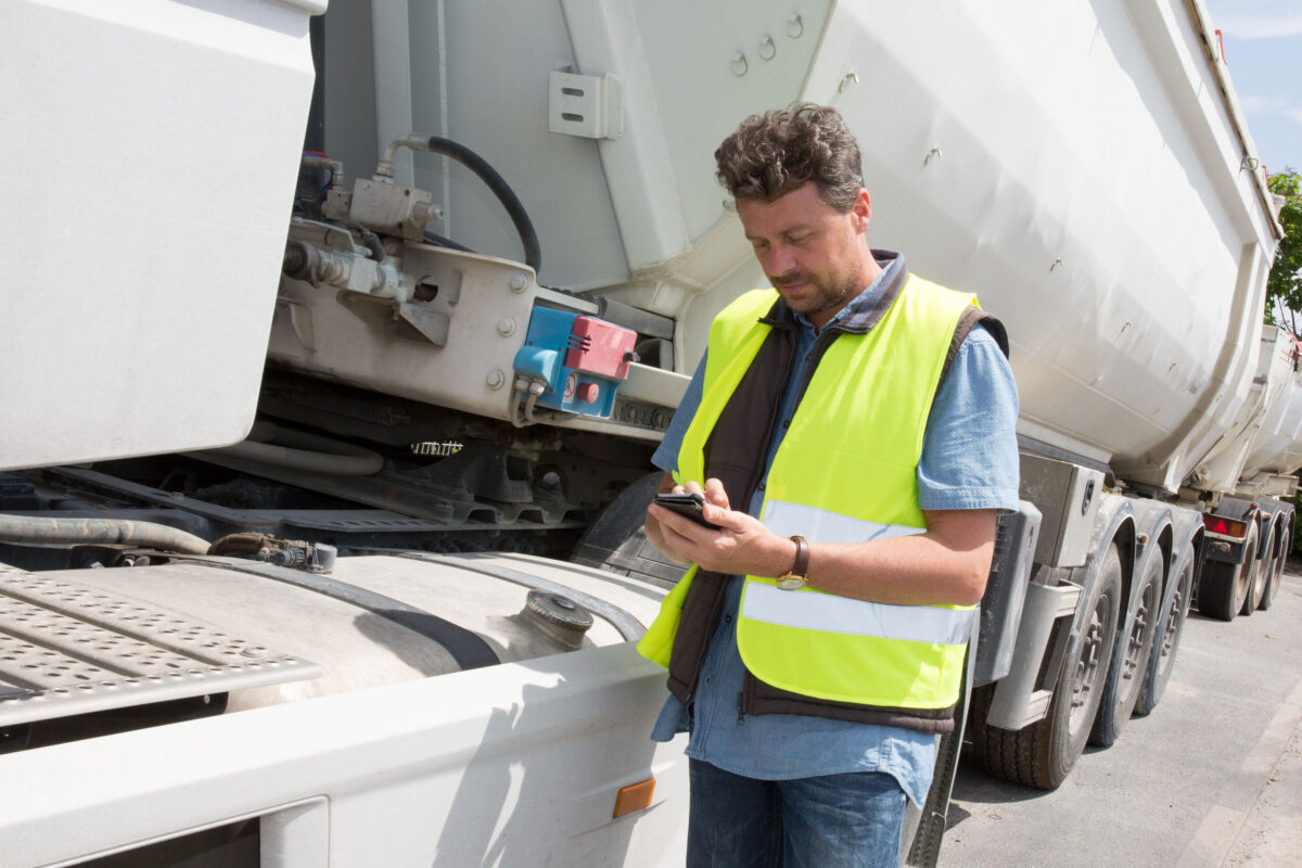 Logistic concept with businessman holding digital tablet use for import, export and logistic background.