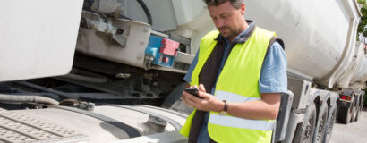 Logistic concept with businessman holding digital tablet use for import, export and logistic background.
