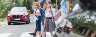 schoolchildren crossing a pedestrian crossing