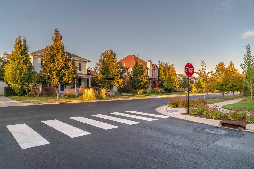 intersection with a stop sign and a crosswalk 