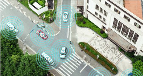 A bird's-eye view of a junction filled with connected cars 